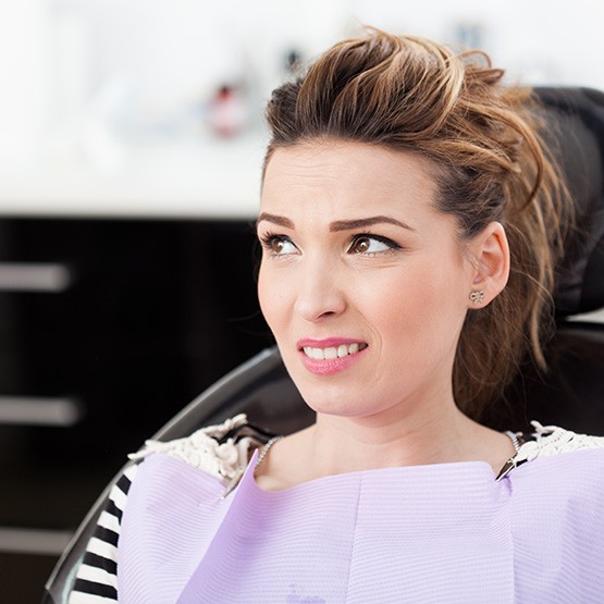 Warning signs of dental phobia include irritability and anxiety in the dental chair