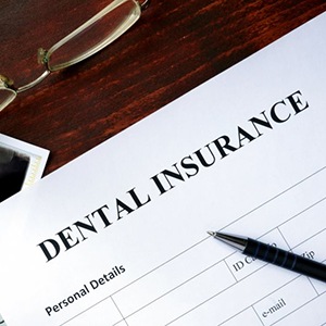 a dental insurance form next to an X-ray image