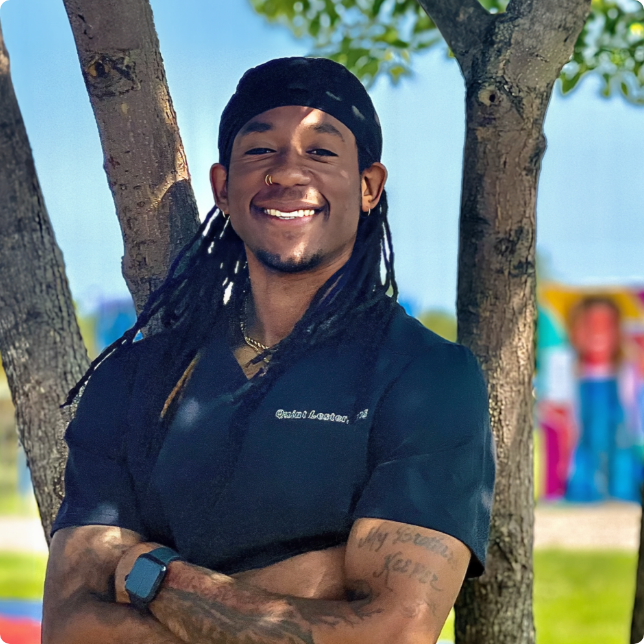 Maplewood dentist Doctor Quintarias Lester smiling outdoors