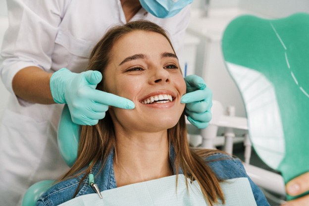 Woman in dental chair smiling