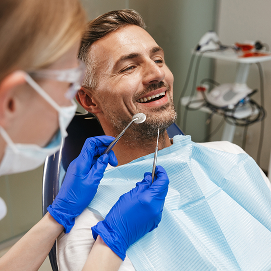 Man smiling during a preventive dental checkup